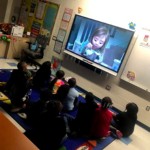 PS 20 students watching video clips from the movie, Inside Out.